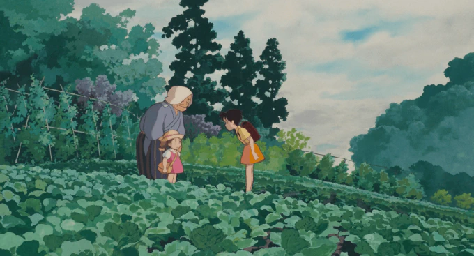 **Fig. 1.1** *Mei and Satsuki amidst the season’s produce* Image of Mei and Satsuke standing in a field of vegetables