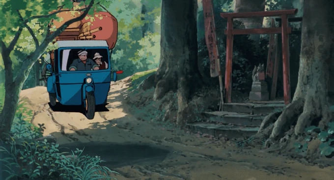 **Fig. 1.3** *The family’s moving truck passes a roadside shrine* Image of a moving truck passing a roadside shrine