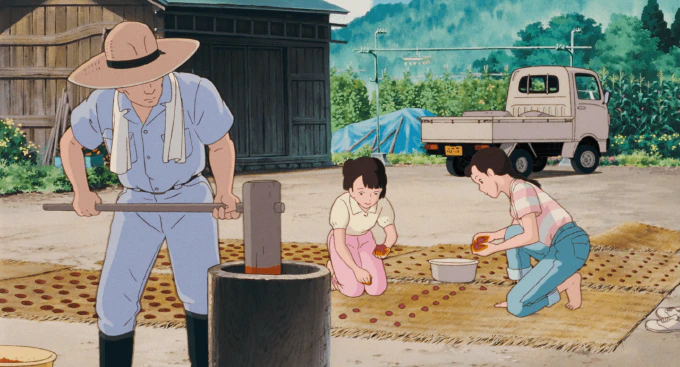 **Fig. 3.2** *Taeko and her host family dry saffron on straw mats in the sun* Image of Taeko laying out saffron on straw mats